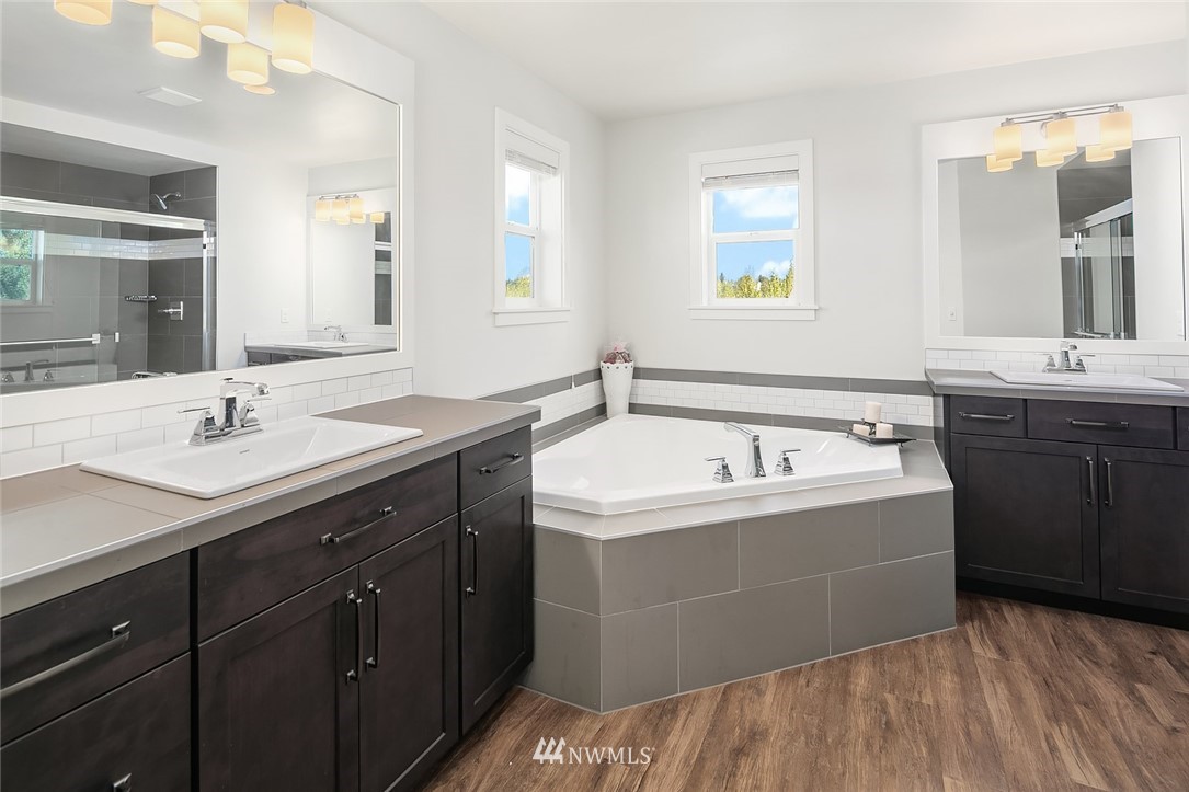 1426 184th Place Southeast Bothell, WA 98012 - Photo 20 of 36 a view of a sink and mirror with window