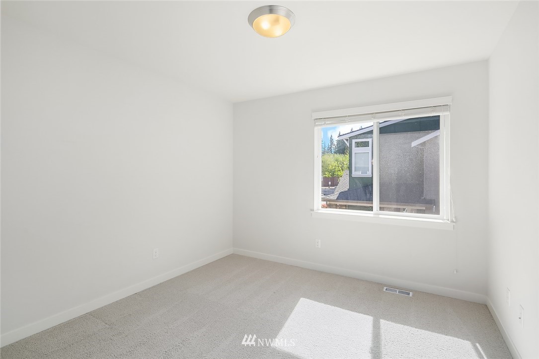 1426 184th Place Southeast Bothell, WA 98012 - Photo 24 of 36 an empty room with a window