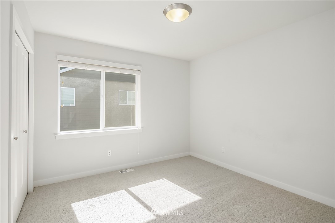1426 184th Place Southeast Bothell, WA 98012 - Photo 25 of 36 an empty room with a window