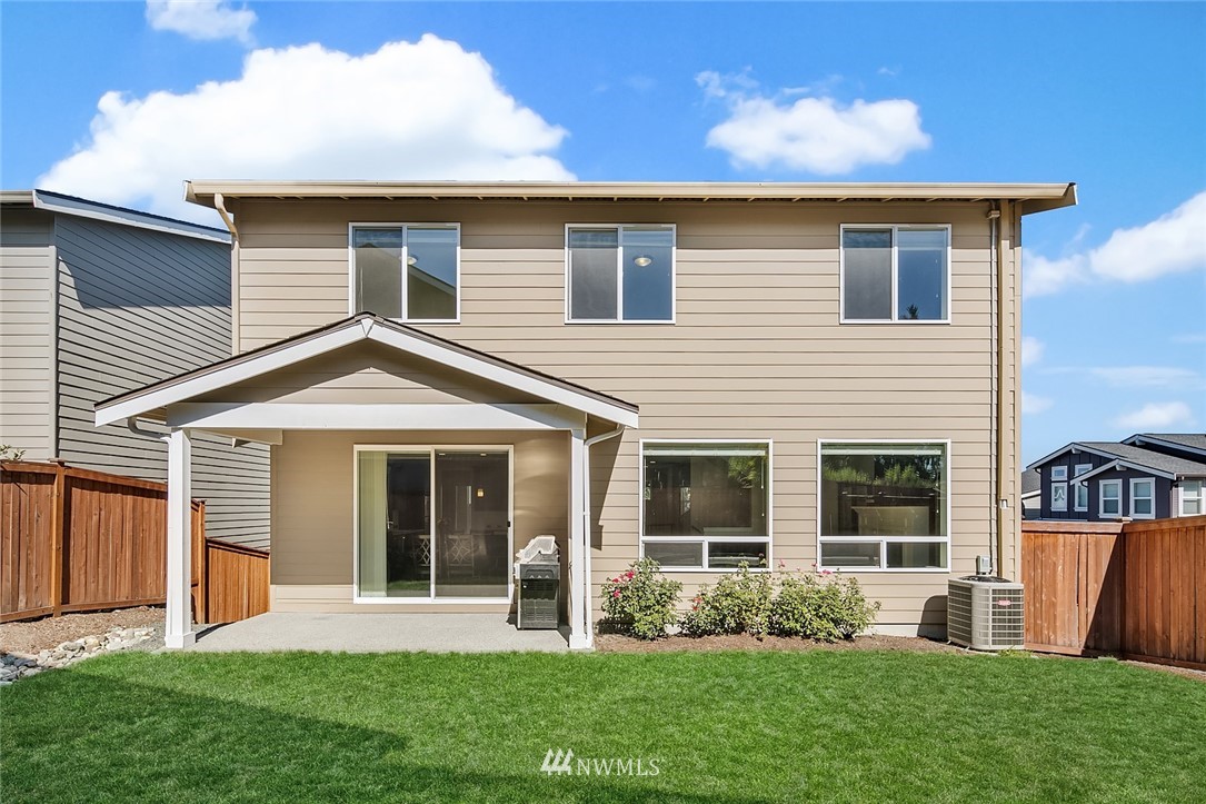 1426 184th Place Southeast Bothell, WA 98012 - Photo 31 of 36 a front view of a house with a garden and yard