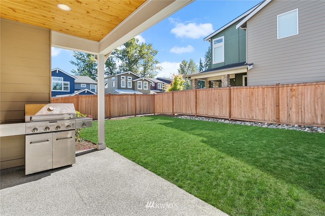 1426 184th Place Southeast Bothell, WA 98012 - Photo 32 of 36 a backyard of a house with barbeque oven