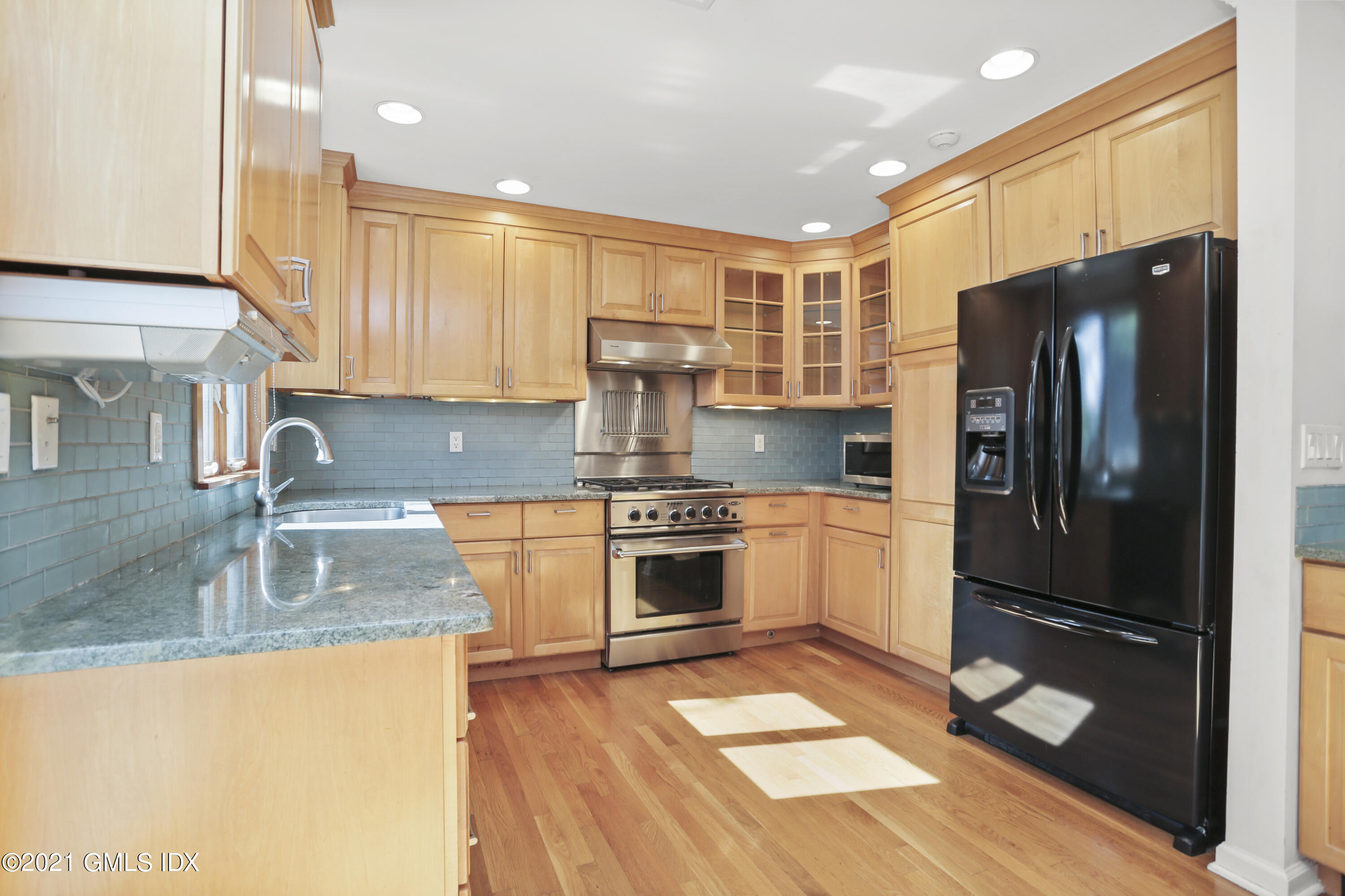 3 Old Wagon Road Old Greenwich, CT 06870 - Photo 12 of 31 a kitchen with granite countertop a refrigerator and a sink