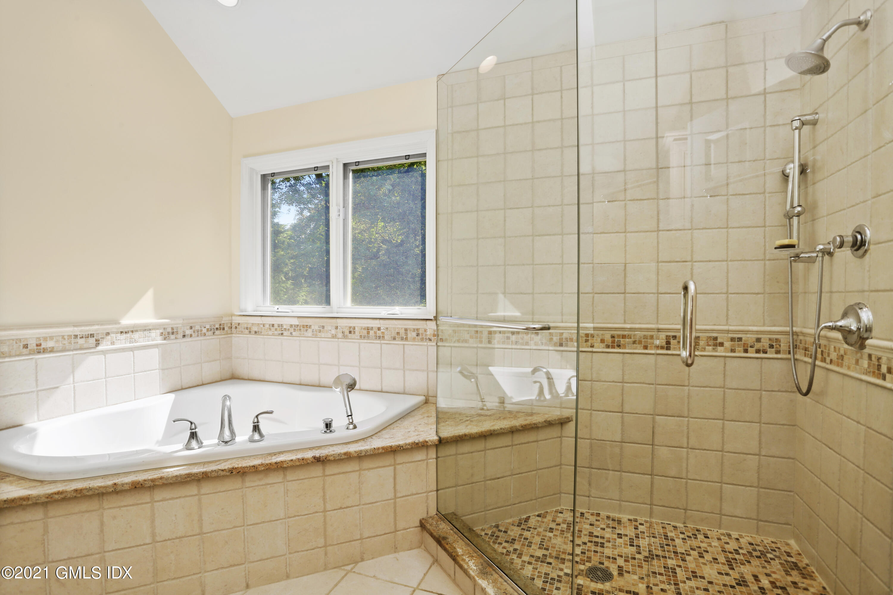 3 Old Wagon Road Old Greenwich, CT 06870 - Photo 19 of 31 a bathroom with a bathtub and shower