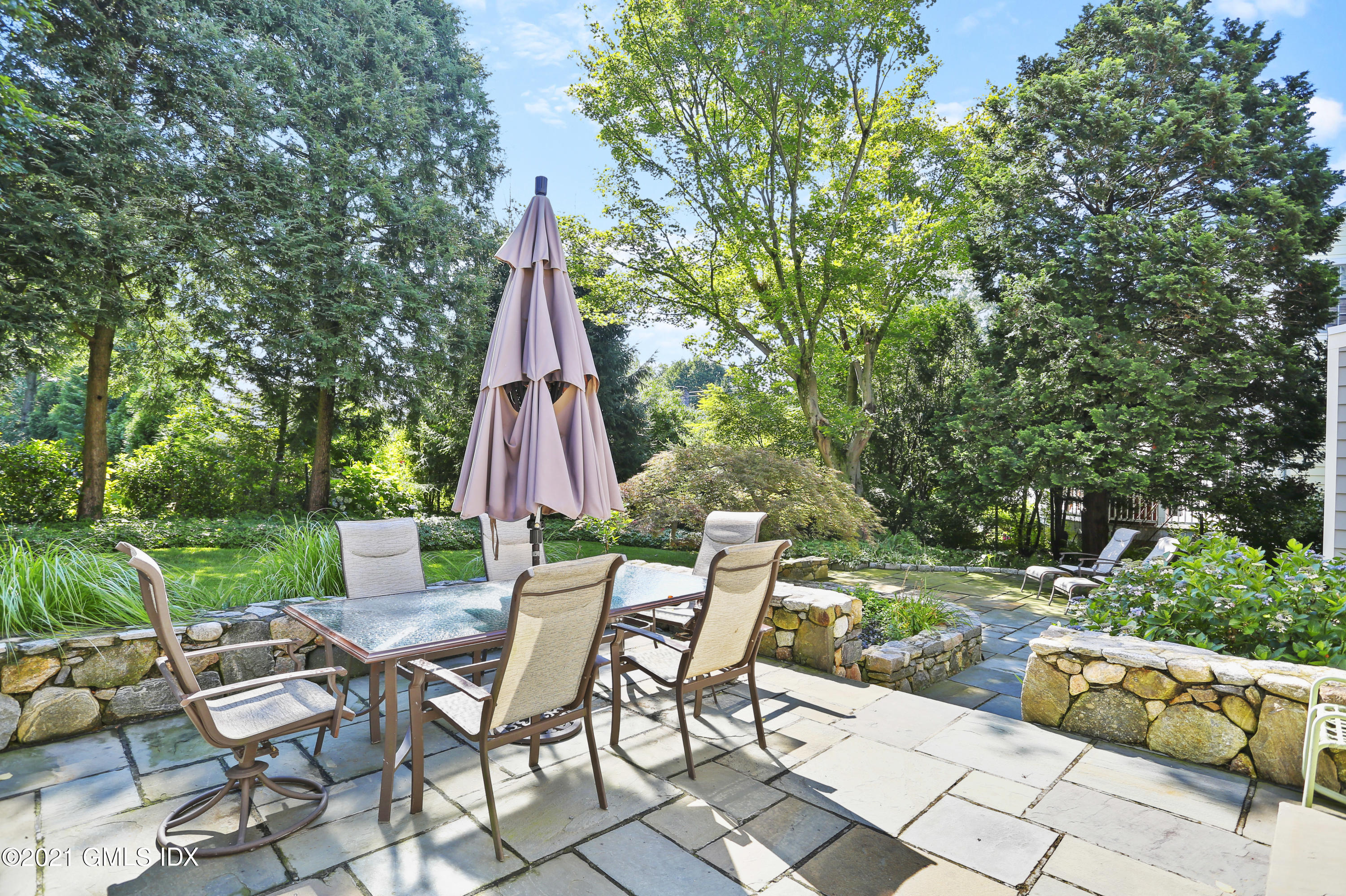 3 Old Wagon Road Old Greenwich, CT 06870 - Photo 25 of 31 a view of backyard with furniture and garden