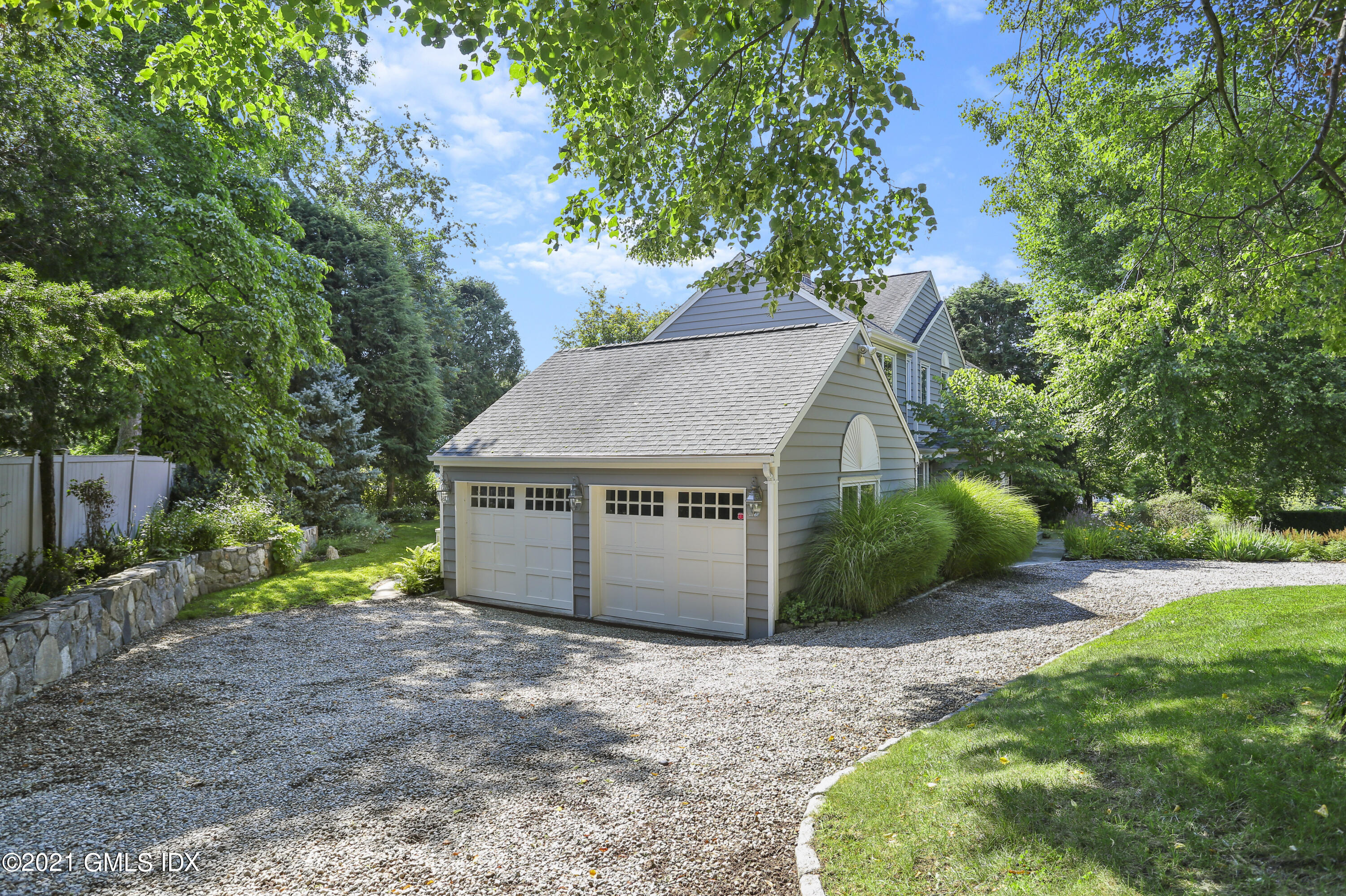3 Old Wagon Road Old Greenwich, CT 06870 - Photo 28 of 31 a house view with a backyard space