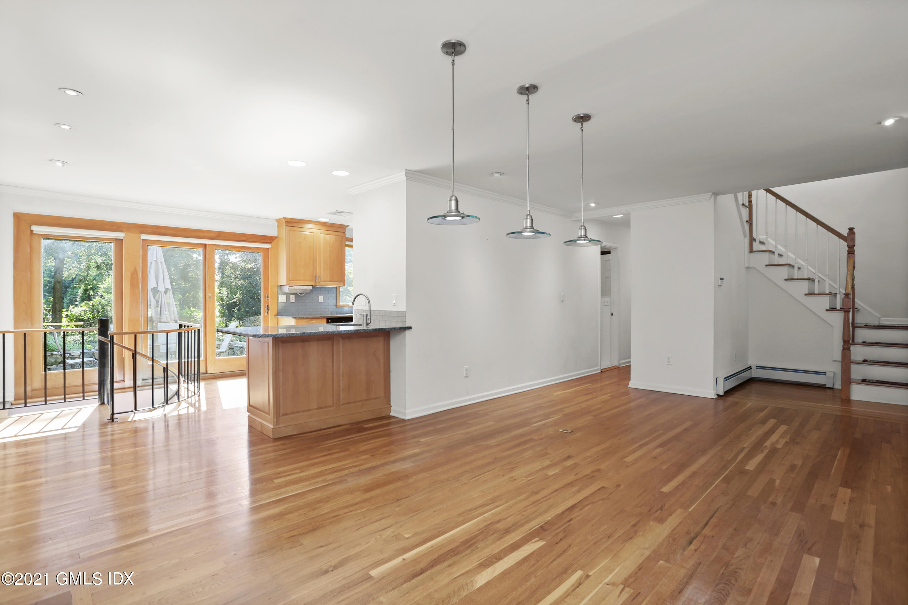 3 Old Wagon Road Old Greenwich, CT 06870 - Photo 7 of 31 a view of empty room with wooden floor and fan