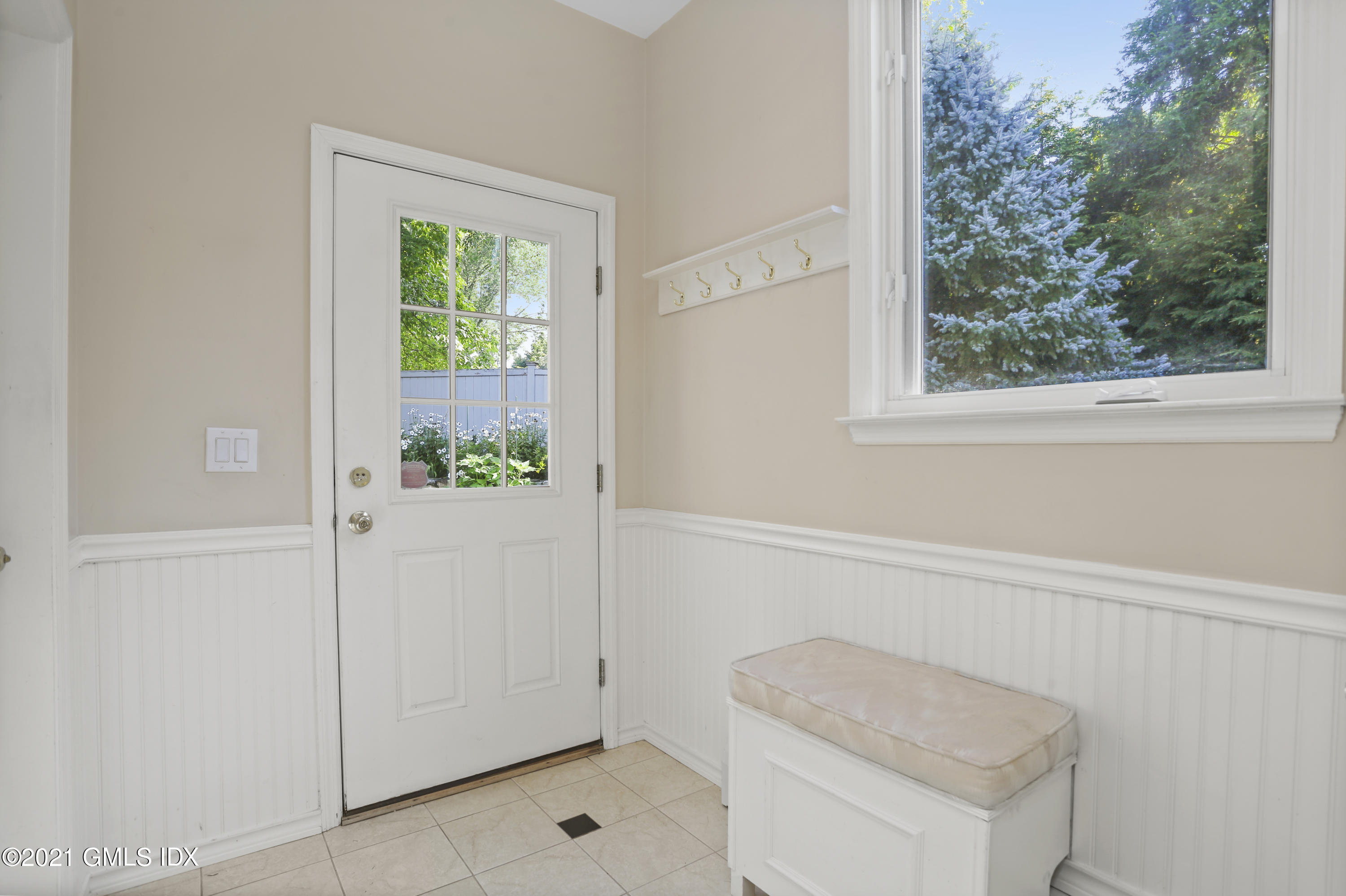 3 Old Wagon Road Old Greenwich, CT 06870 - Photo 9 of 31 a bathroom with a sink and a mirror
