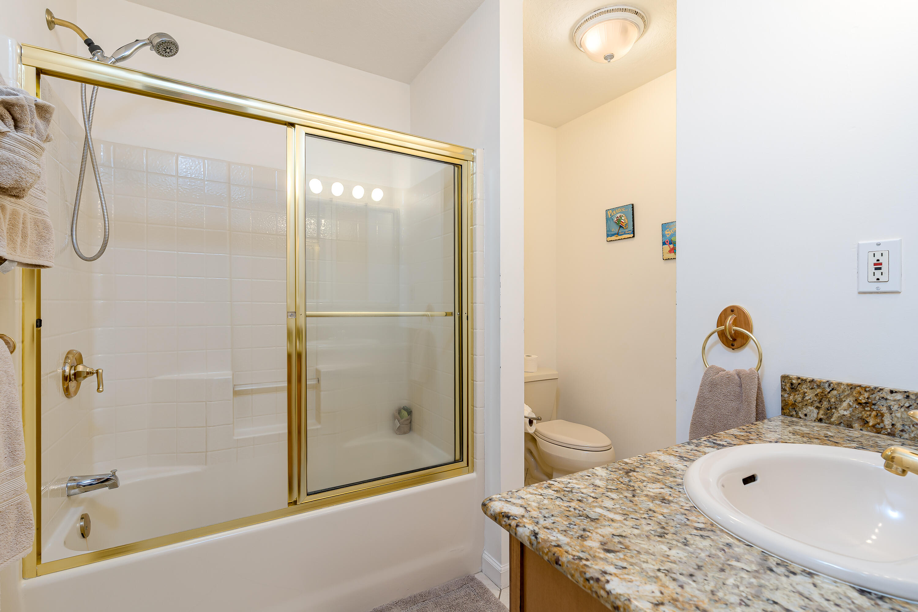 260 Sadowski Causeway Key Colony Beach, FL 33051 - Photo 19 of 50 a bathroom with a granite countertop sink a toilet and shower