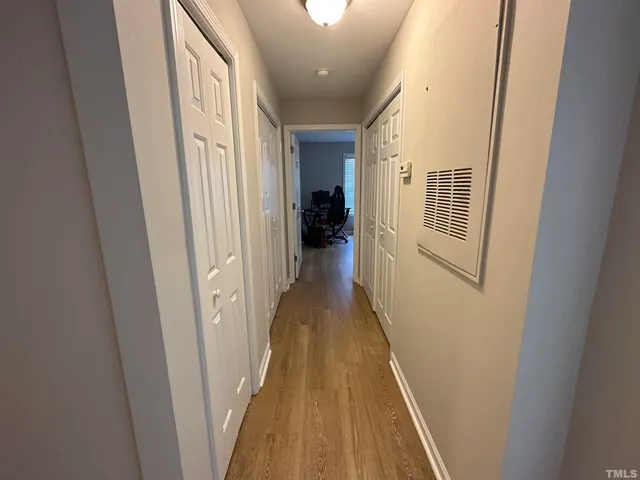 a bedroom with a bed and a mirror