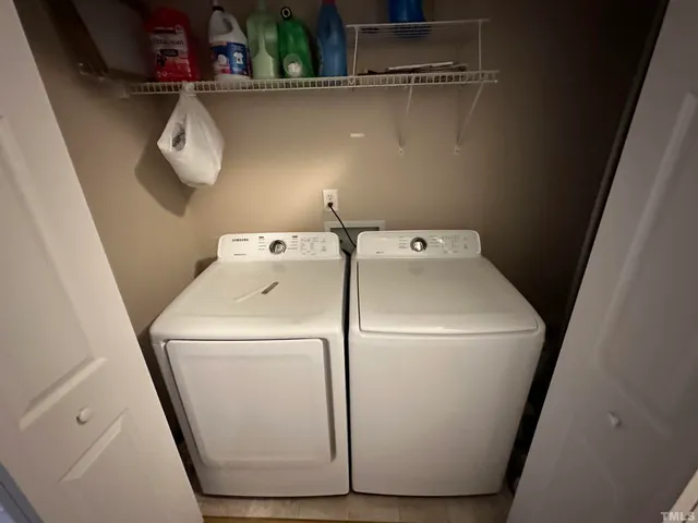 a white toilet sitting next to a shower curtain