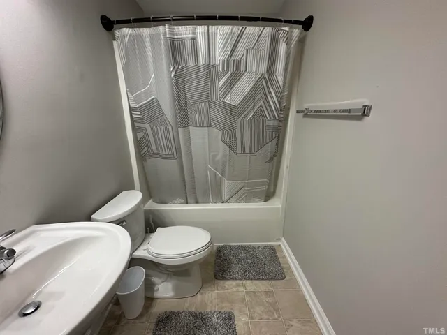 a view of pool with small yard