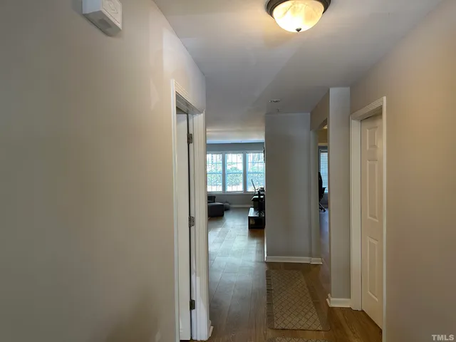 a living room with furniture and kitchen