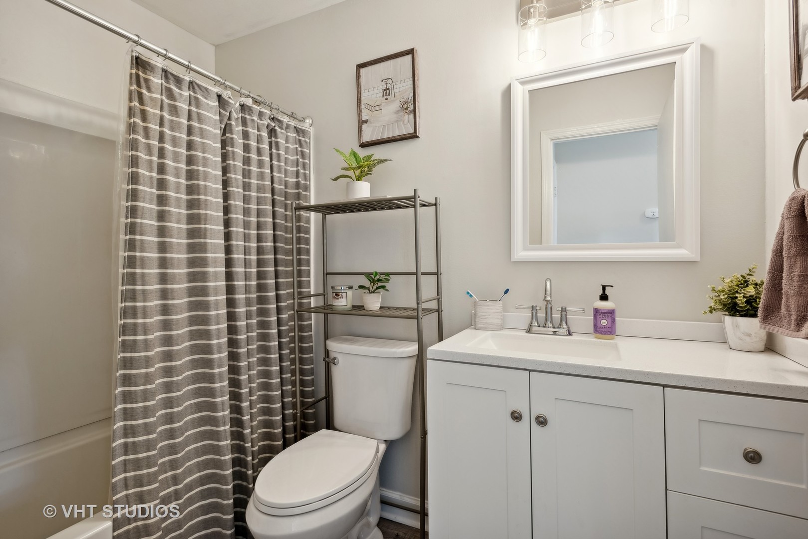 1651 Timber Trail Wheaton, IL 60189 - Photo 13 of 26 a bathroom with a toilet sink vanity and mirror