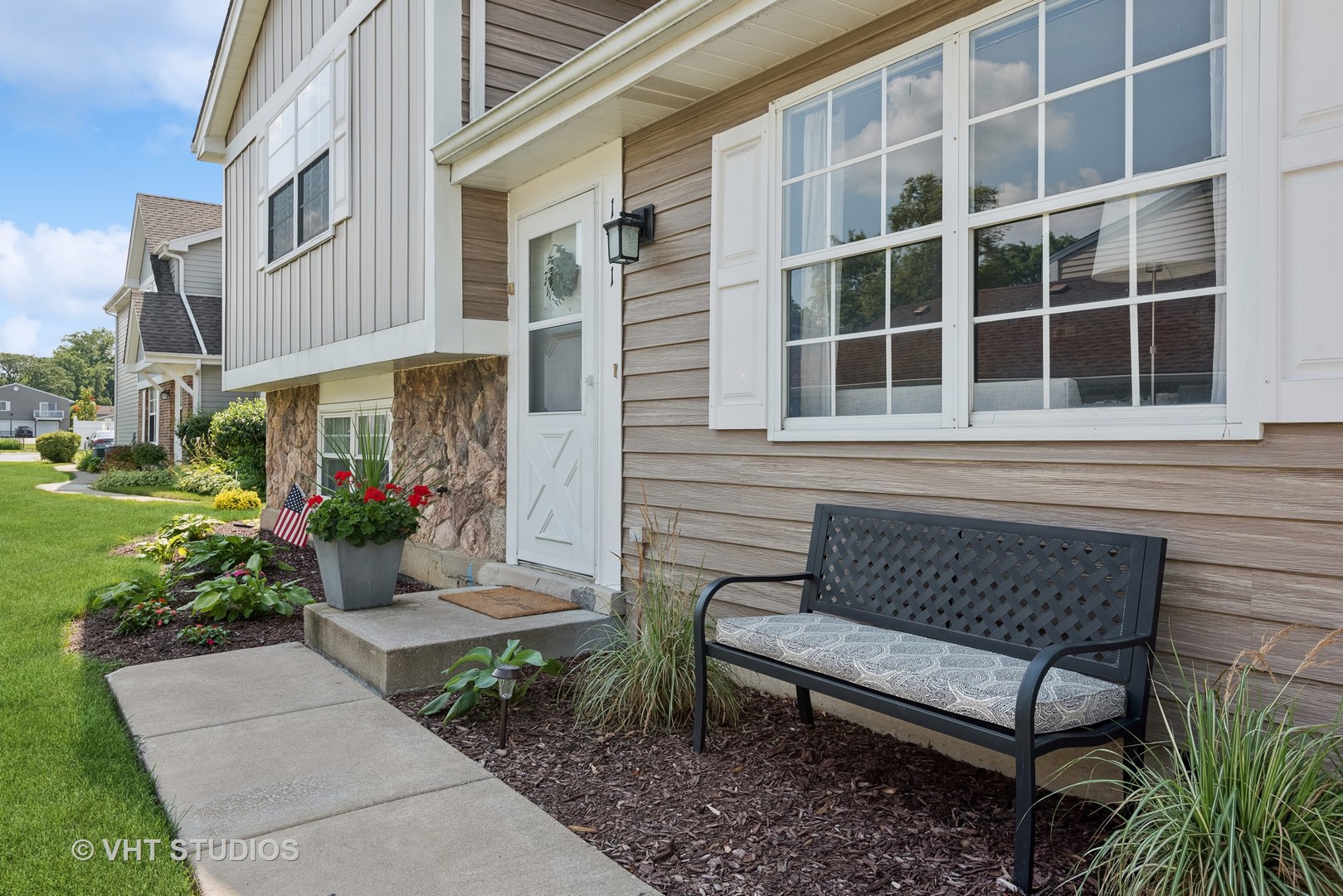 1651 Timber Trail Wheaton, IL 60189 - Photo 2 of 26 a view of a bench sitting in back yard of a building