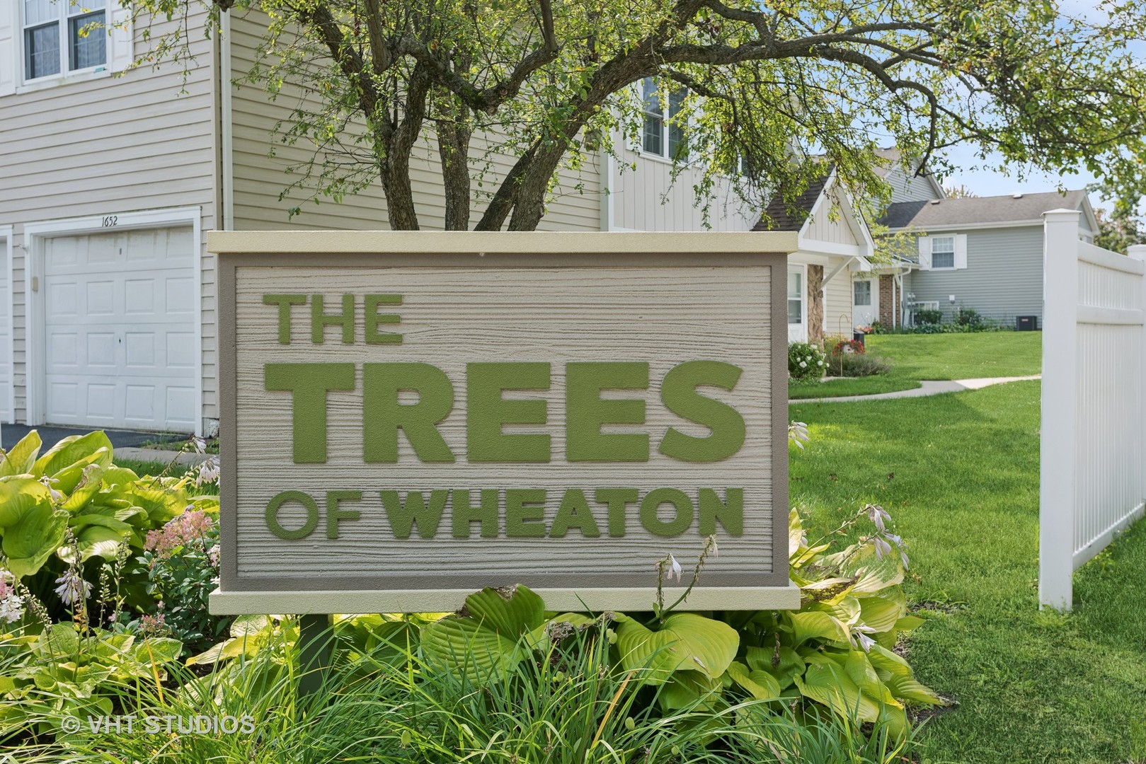 1651 Timber Trail Wheaton, IL 60189 - Photo 22 of 26 a front view of a house with a garden