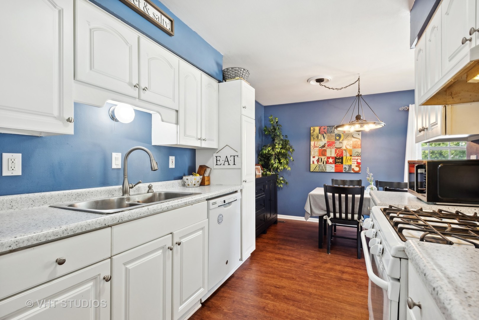 1651 Timber Trail Wheaton, IL 60189 - Photo 7 of 26 a kitchen with cabinets a sink and a stove