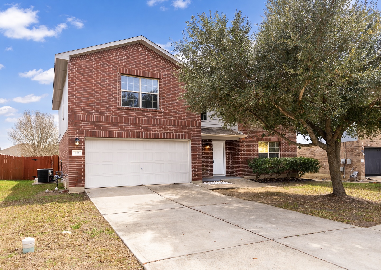 210 King Ridge Drive Buda, TX 78610 - Photo 29 of 29 Traditional-style home featuring brick siding, driveway, and a garage