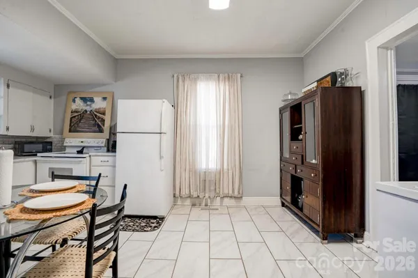 a kitchen with stainless steel appliances a refrigerator sink and cabinets
