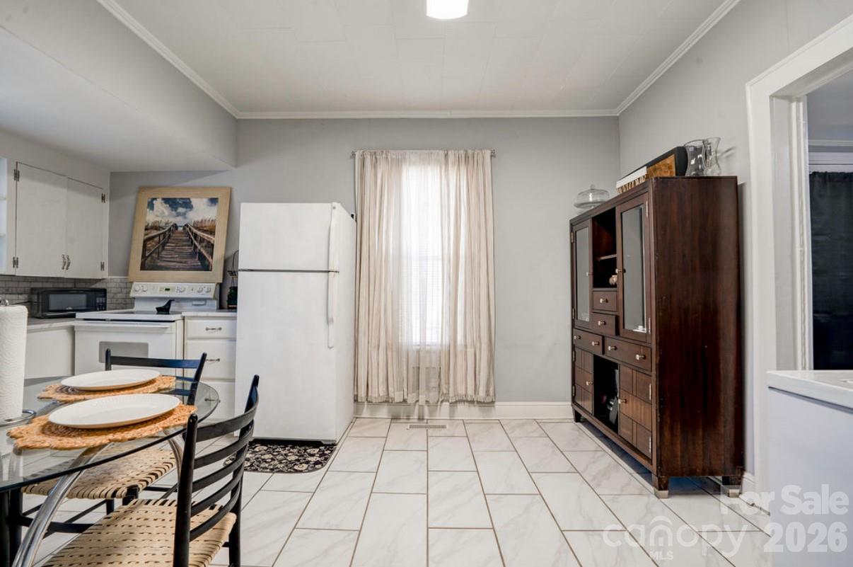 403 Whitener Street Shelby, NC 28152 - Photo 17 of 29 a kitchen with stainless steel appliances a refrigerator sink and cabinets
