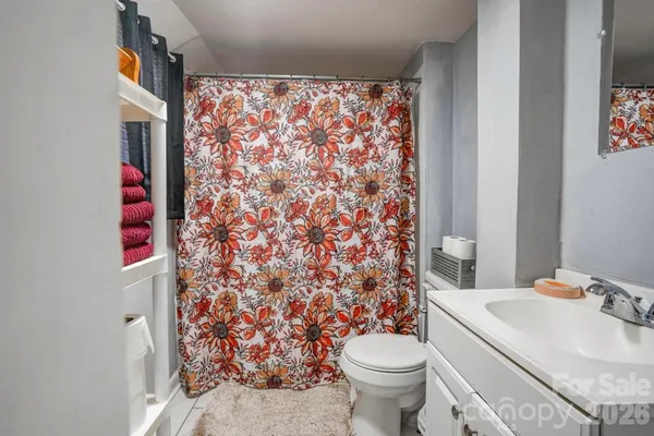 a bathroom with a sink and toilet