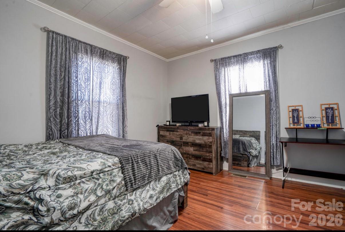 403 Whitener Street Shelby, NC 28152 - Photo 23 of 29 a bedroom with a bed and a flat screen tv