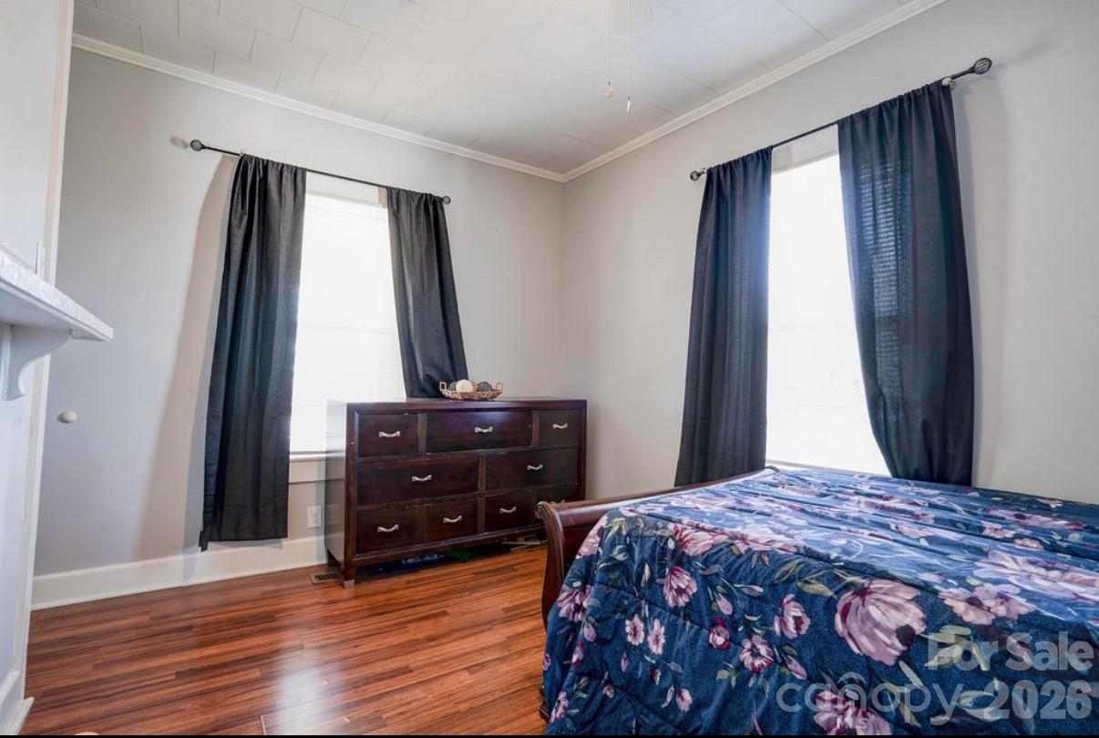 403 Whitener Street Shelby, NC 28152 - Photo 27 of 29 a bedroom with a bed and a dresser