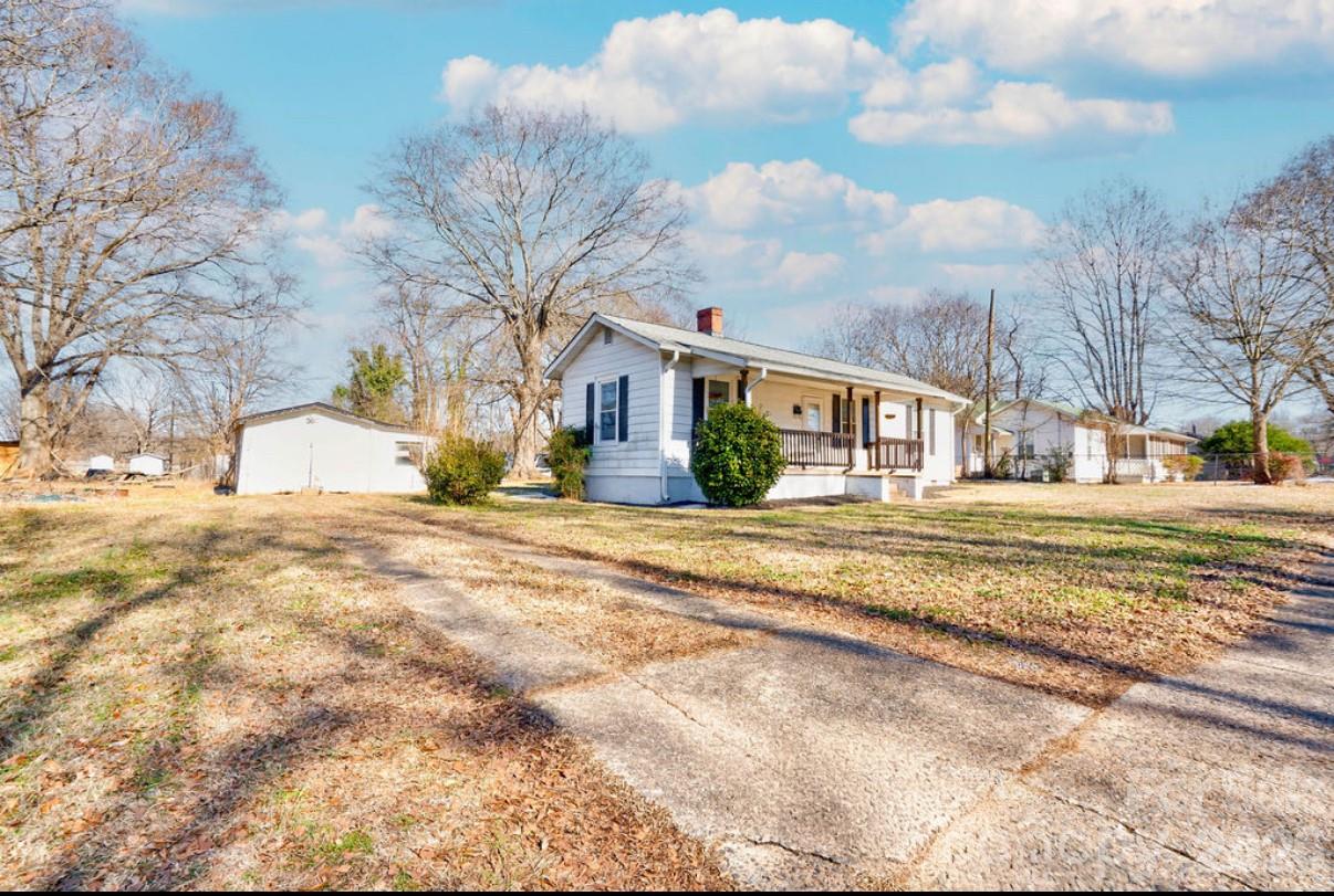 403 Whitener Street Shelby, NC 28152 - Photo 3 of 29 a view of road with large trees