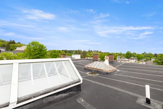 a view of balcony with furniture