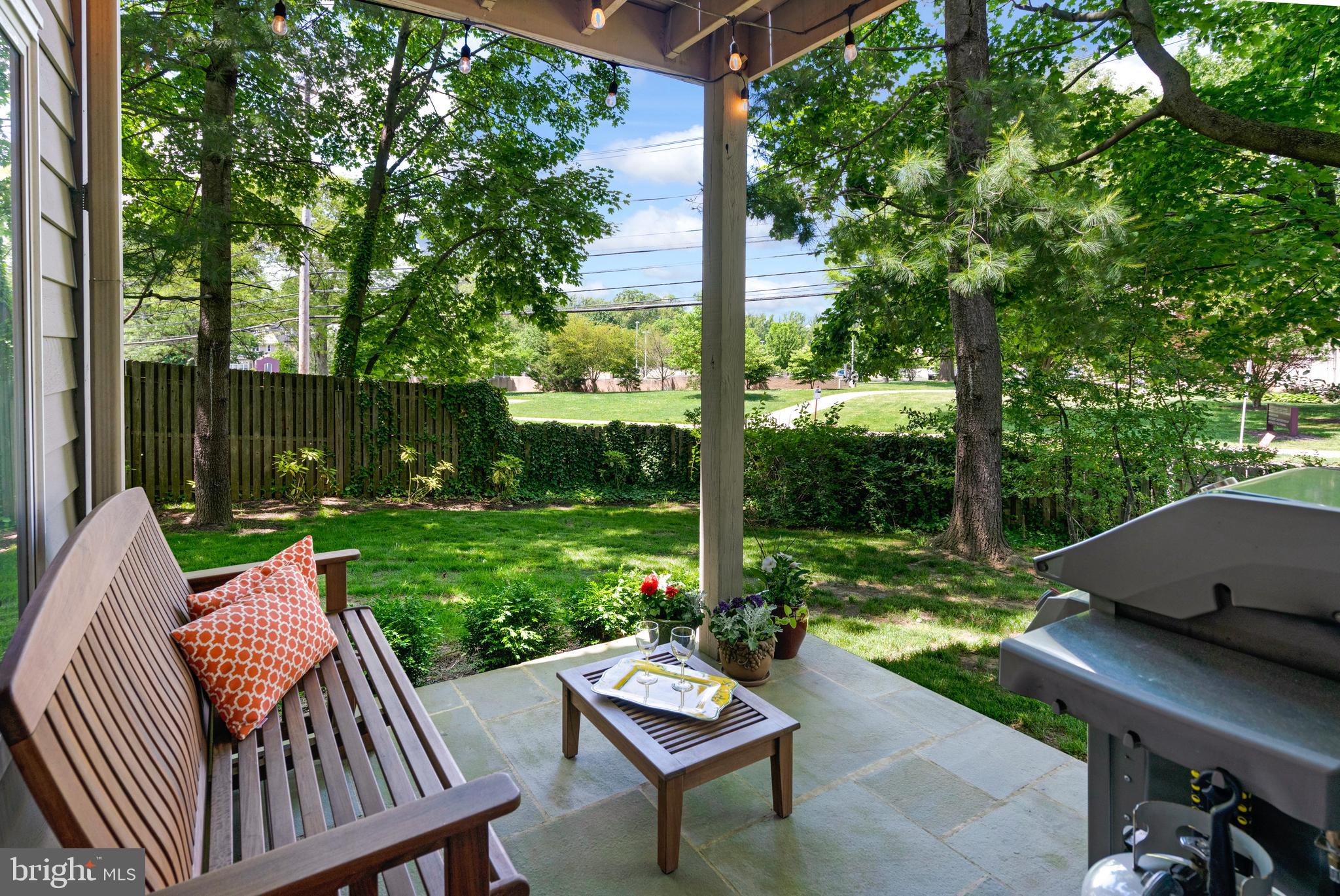 232 Church Road, Unit 3B Ardmore, PA 19003 - Photo 14 of 18 a view of a patio with a table chairs and a backyard