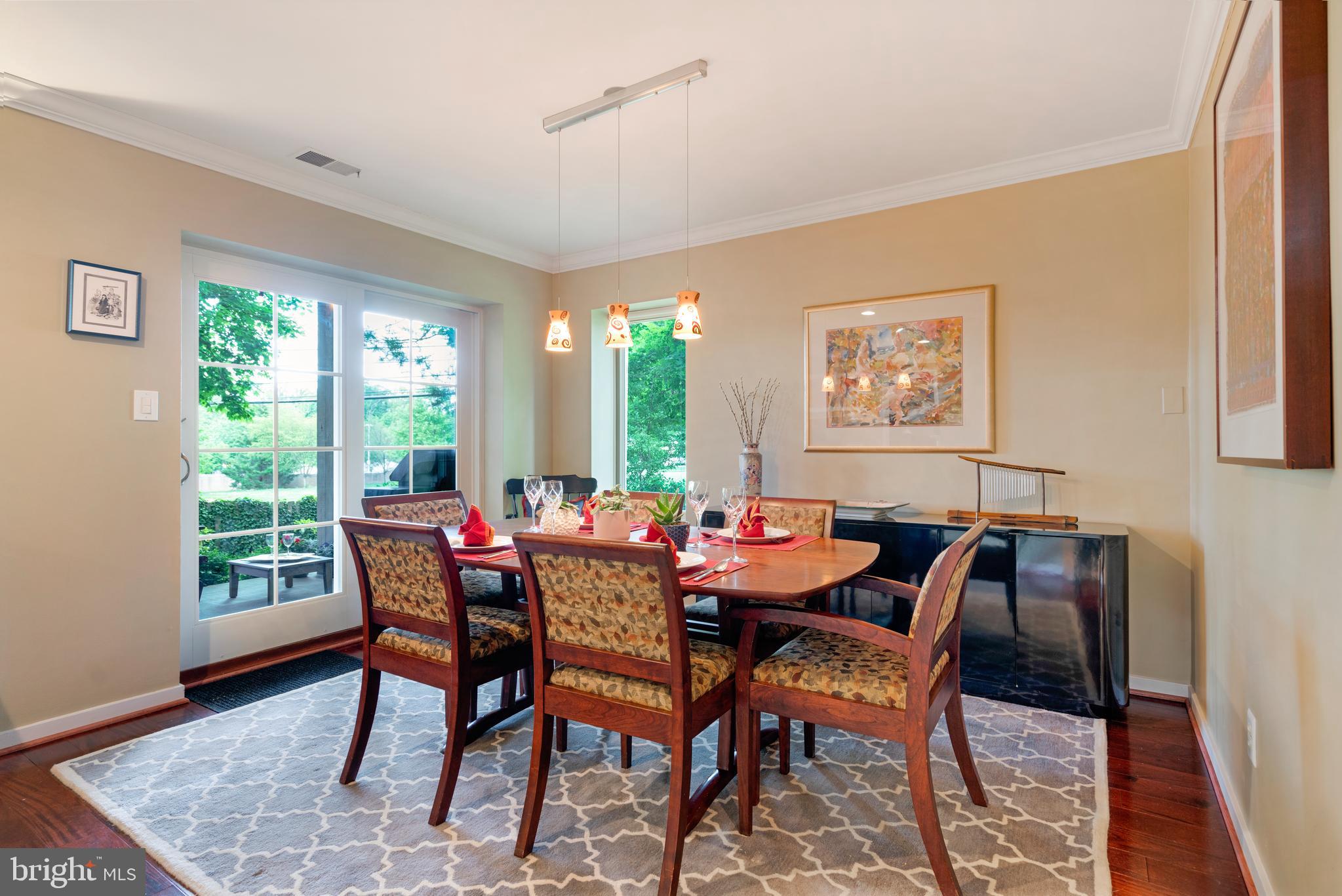 232 Church Road, Unit 3B Ardmore, PA 19003 - Photo 4 of 18 a view of a dining room with furniture window and wooden floor
