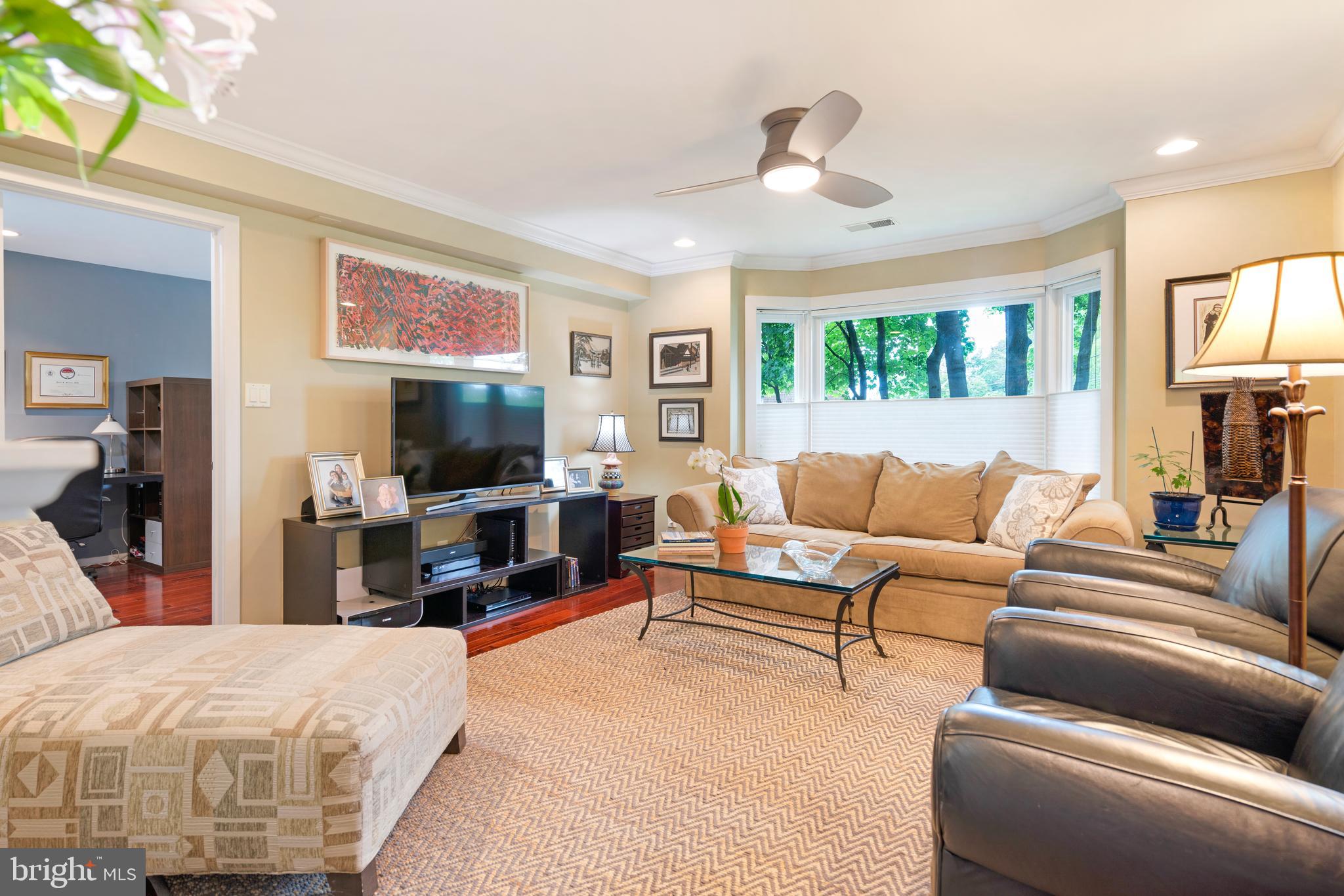 232 Church Road, Unit 3B Ardmore, PA 19003 - Photo 5 of 18 a living room with furniture and a flat screen tv