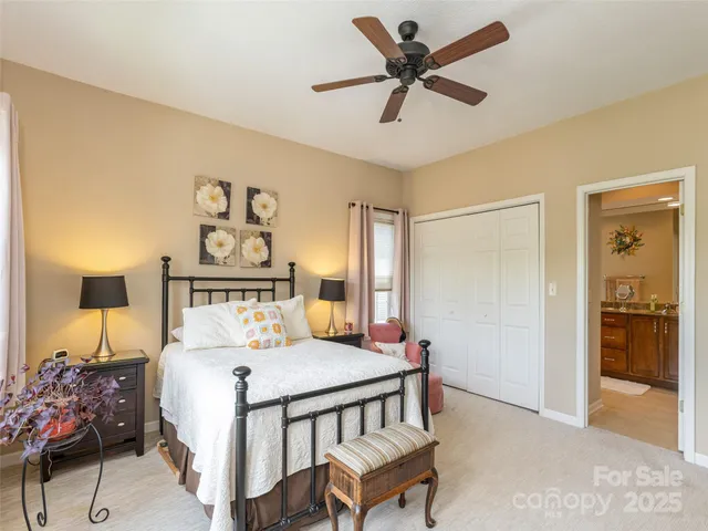 a bedroom with a bed and a table in it