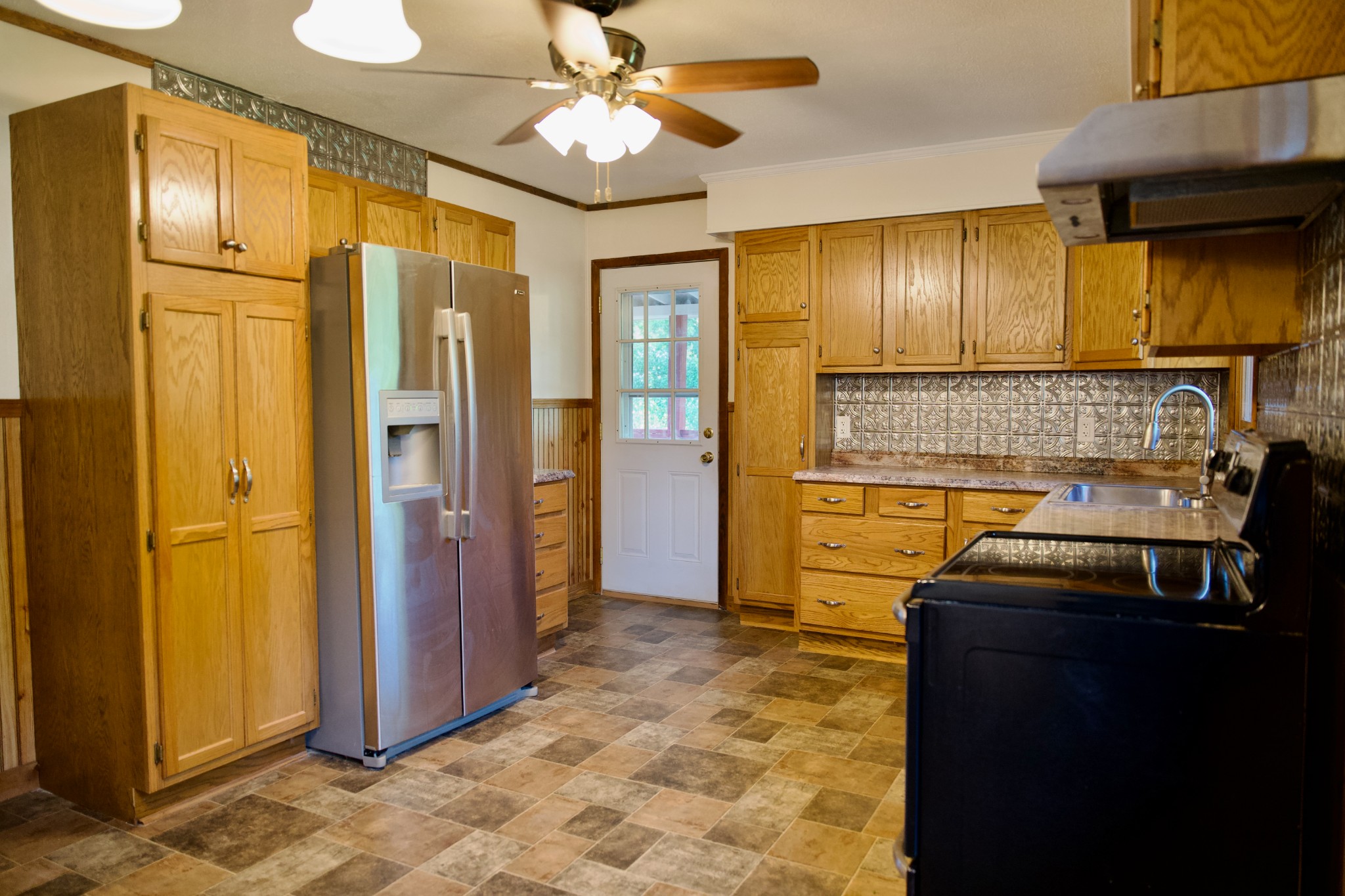 570 Forest Circle Sparta, TN 38583 - Photo 11 of 27 a kitchen that has a refrigerator and a stove