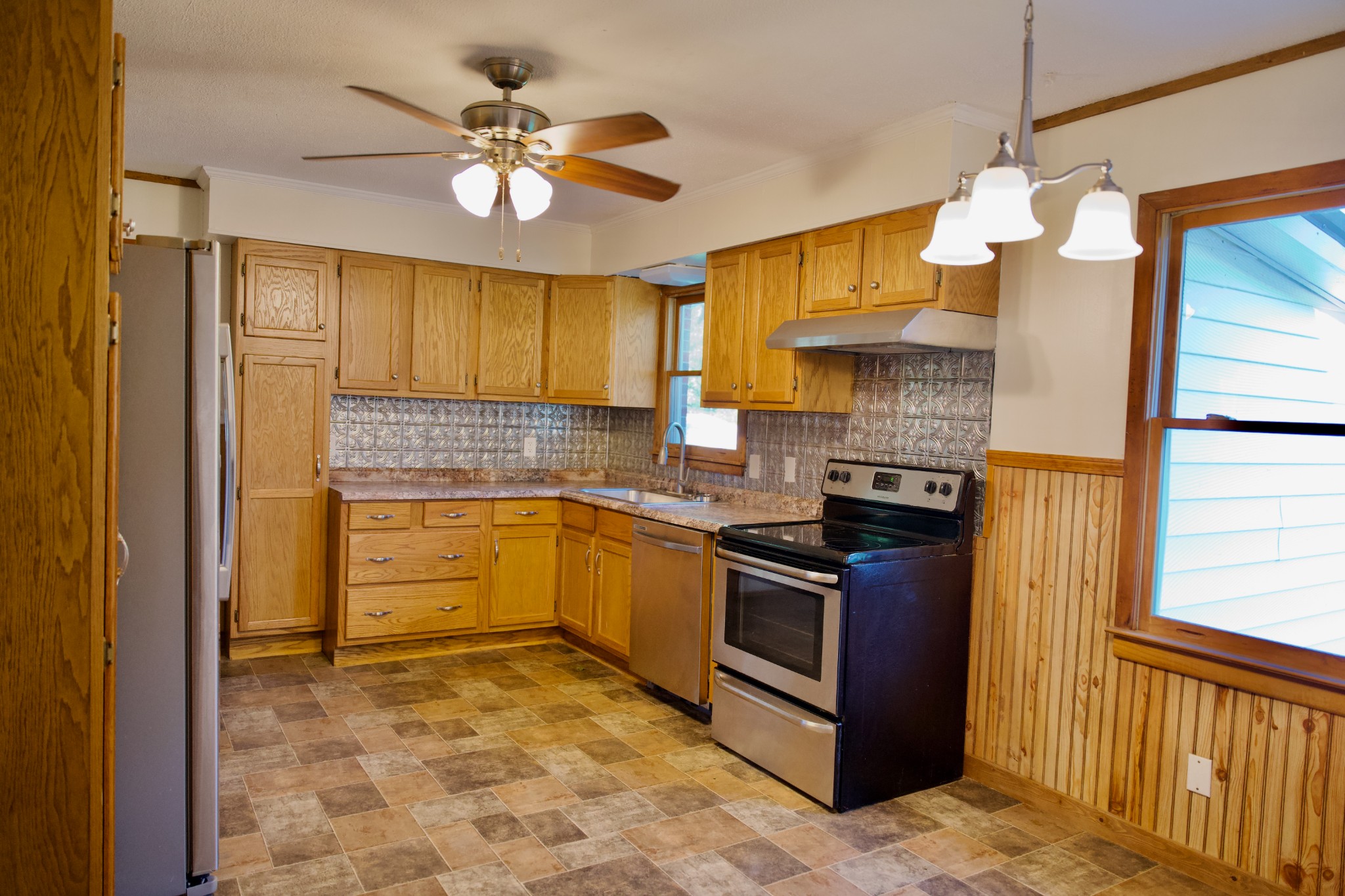 570 Forest Circle Sparta, TN 38583 - Photo 12 of 27 a kitchen with a stove a sink and a refrigerator