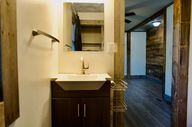 a bathroom with a sink and a mirror
