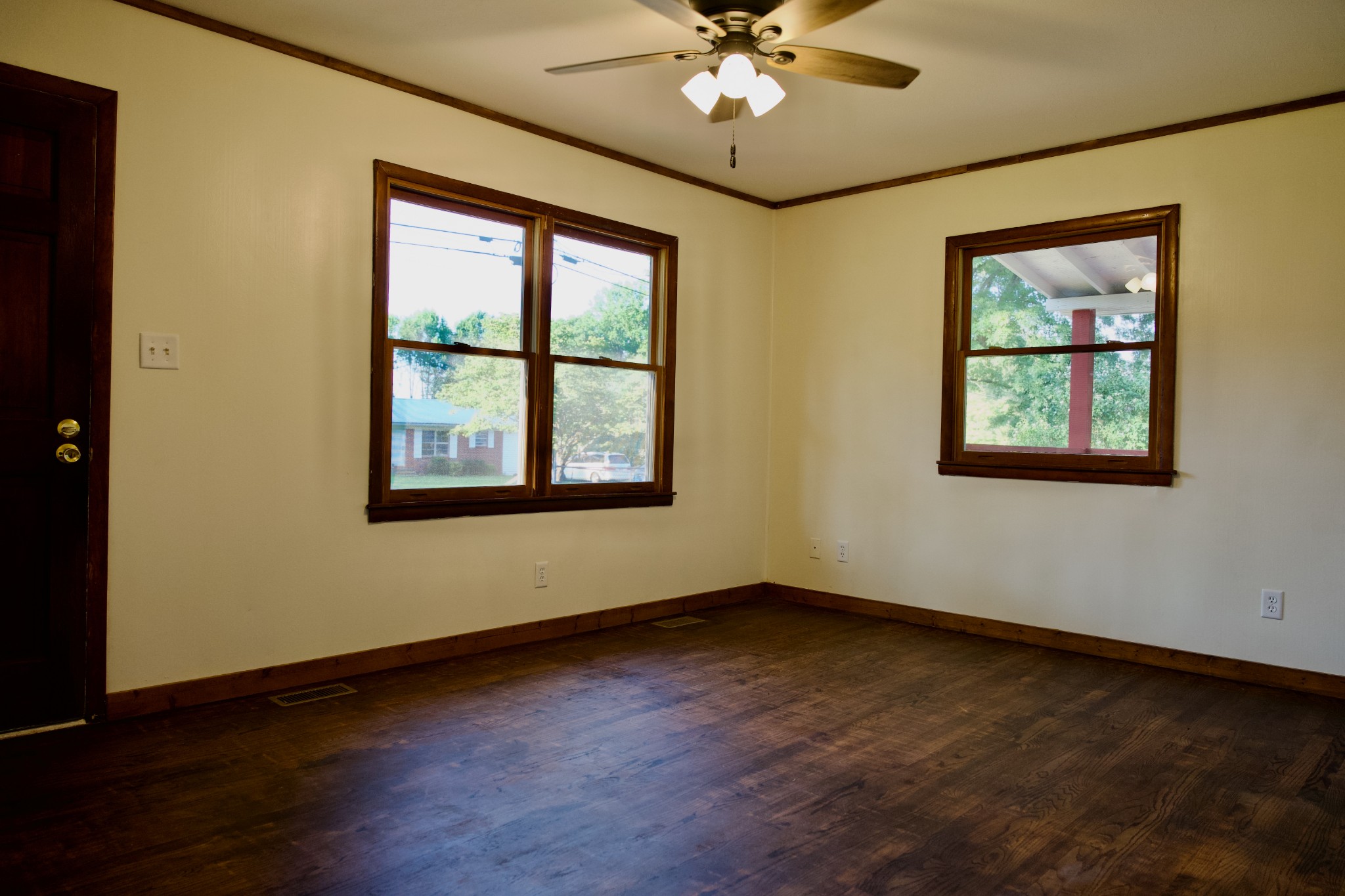 570 Forest Circle Sparta, TN 38583 - Photo 19 of 27 a view of an empty room with wooden floor and a window