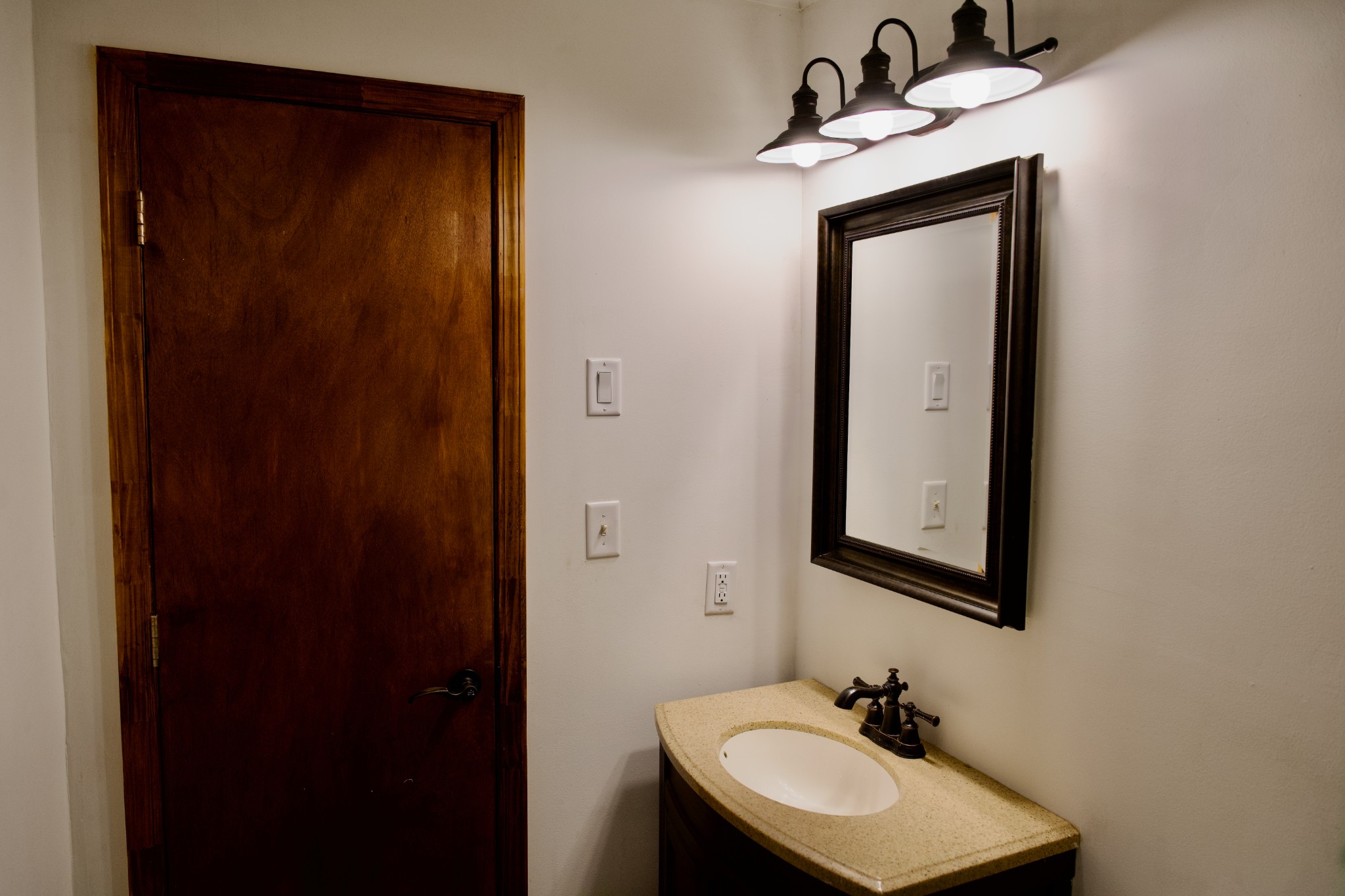 570 Forest Circle Sparta, TN 38583 - Photo 24 of 27 a bathroom with a sink and a mirror