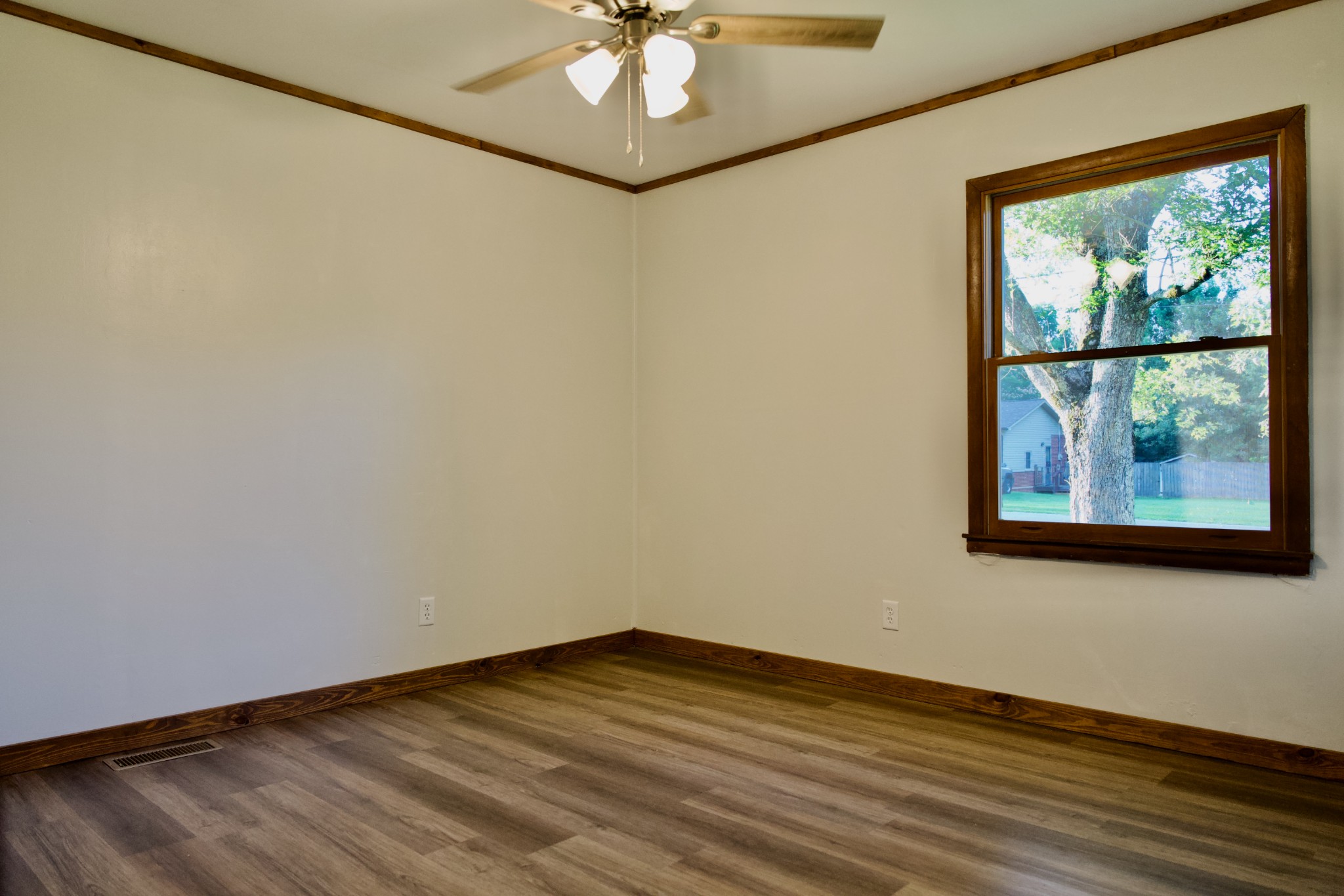 570 Forest Circle Sparta, TN 38583 - Photo 26 of 27 a view of empty room with wooden floor and fan
