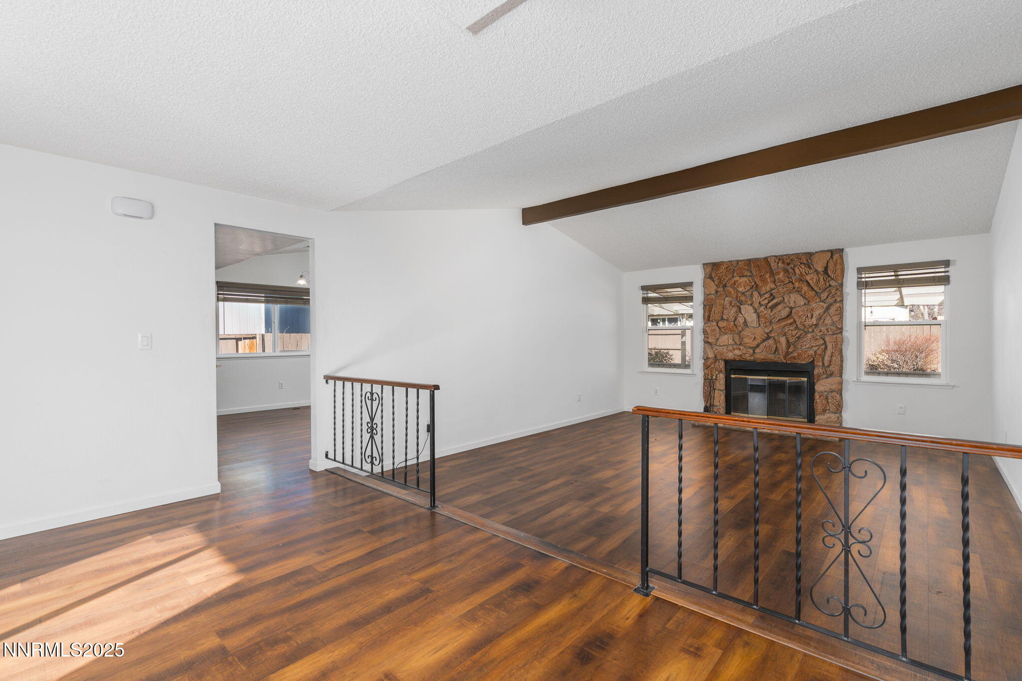 1266 Junction Drive Sparks, NV 89434 - Photo 11 of 32 a view of a livingroom with wooden floor and kitchen view