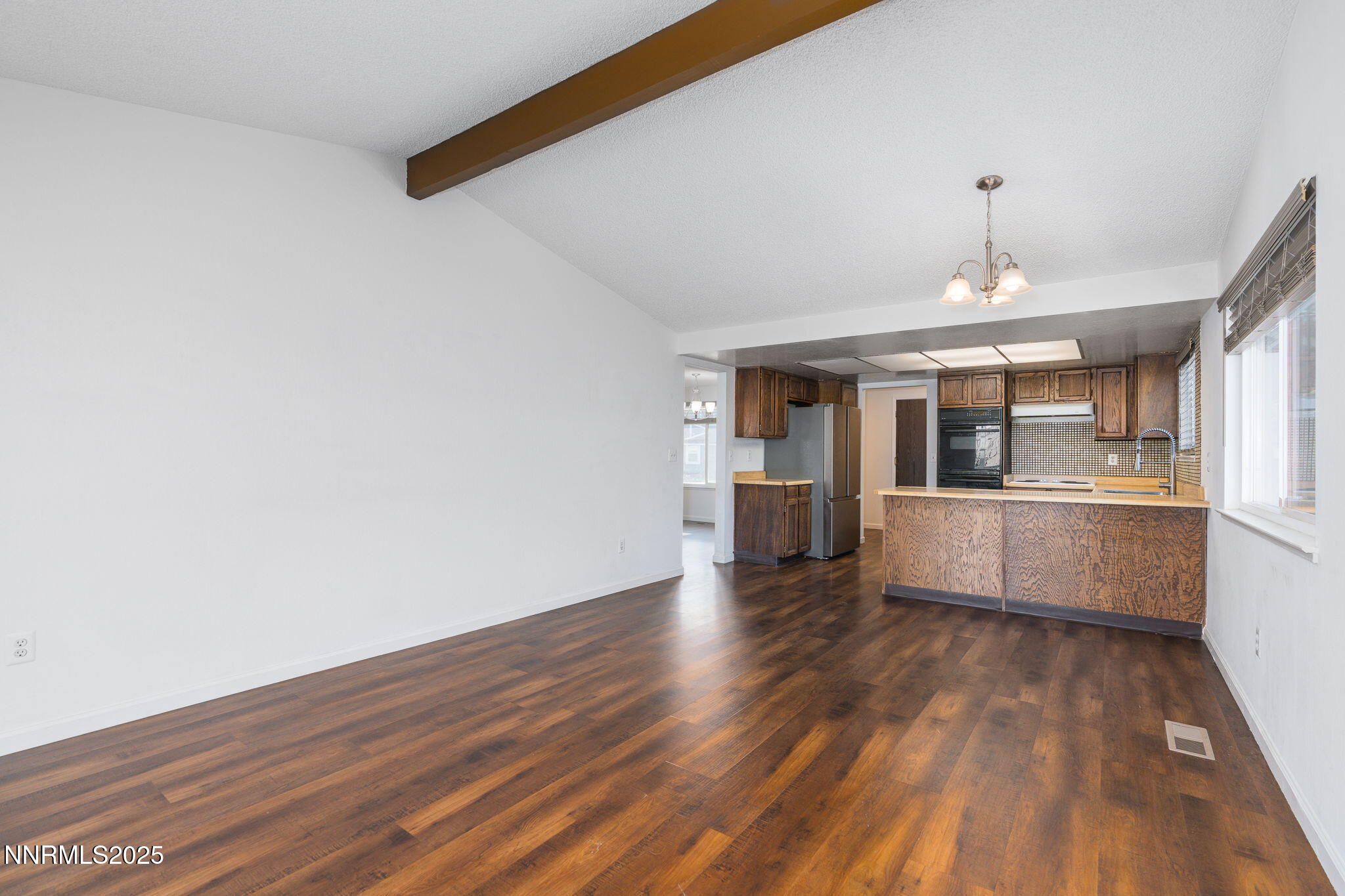 1266 Junction Drive Sparks, NV 89434 - Photo 12 of 32 a view of a kitchen with wooden floor and a kitchen