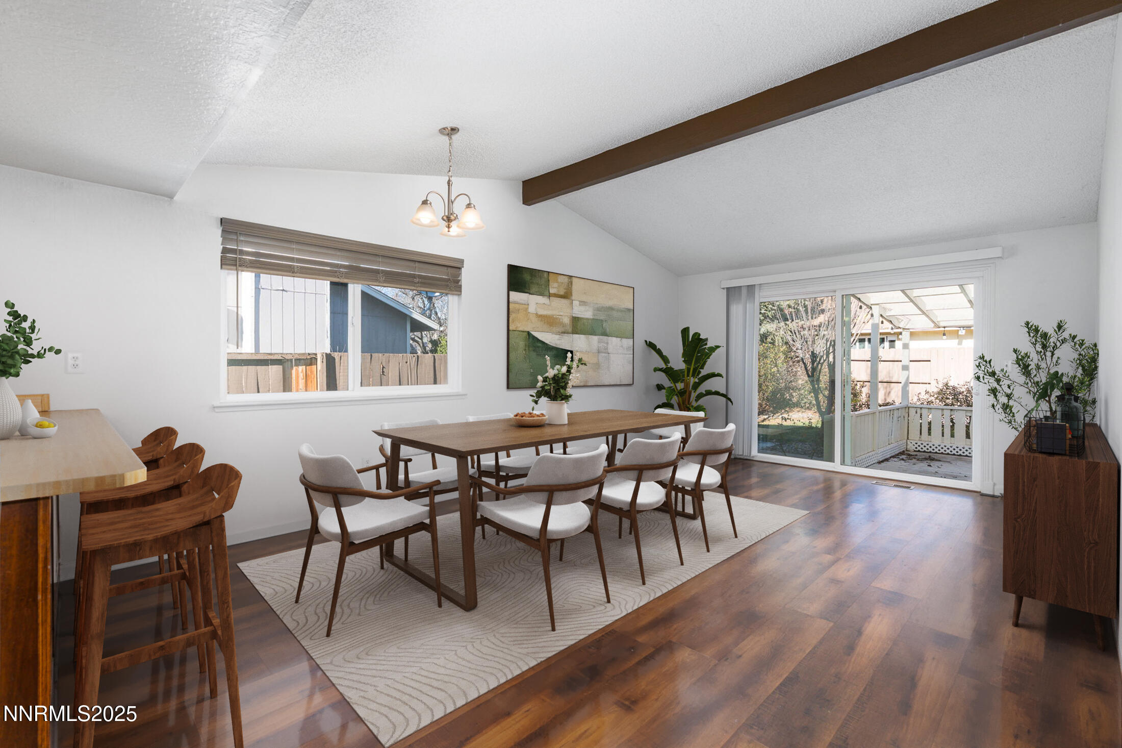 1266 Junction Drive Sparks, NV 89434 - Photo 13 of 32 a dining room with wooden floor a chandelier a wooden table and chairs