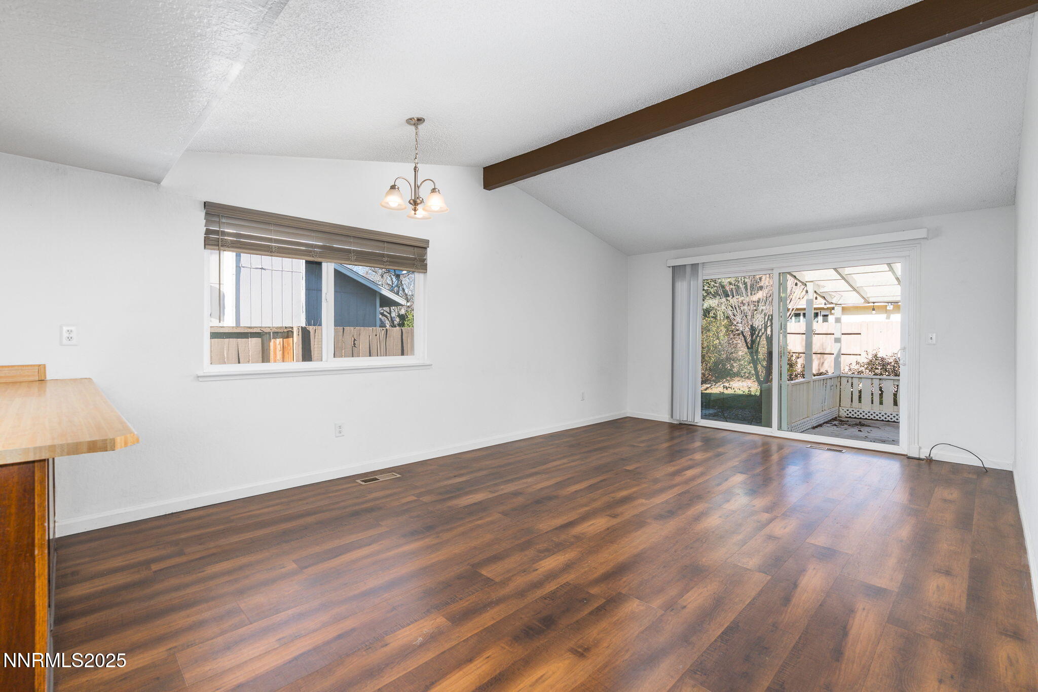 1266 Junction Drive Sparks, NV 89434 - Photo 14 of 32 a view of an empty room with wooden floor and a window