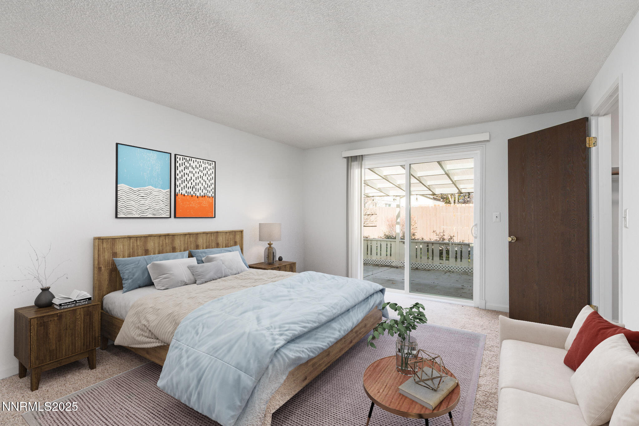 1266 Junction Drive Sparks, NV 89434 - Photo 18 of 32 a bedroom with a bed and a couch