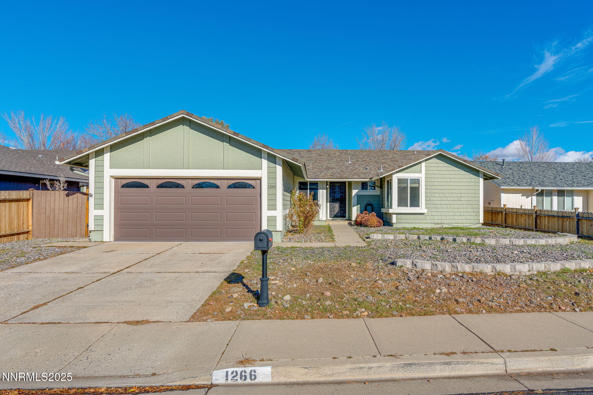 1266 Junction Drive Sparks, NV 89434 - Photo 2 of 32 a front view of a house with garage