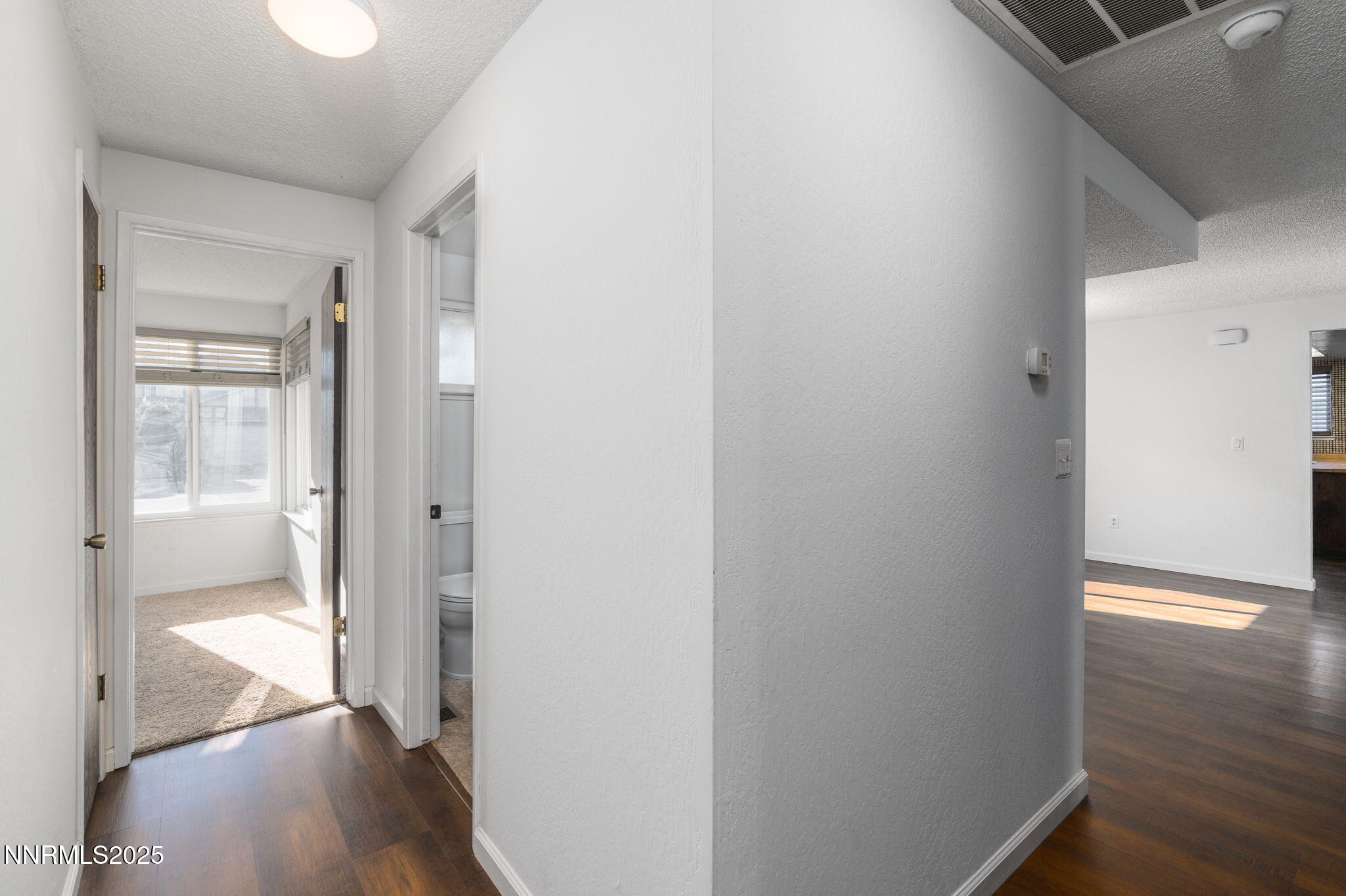 1266 Junction Drive Sparks, NV 89434 - Photo 22 of 32 a view of a hallway with wooden floor