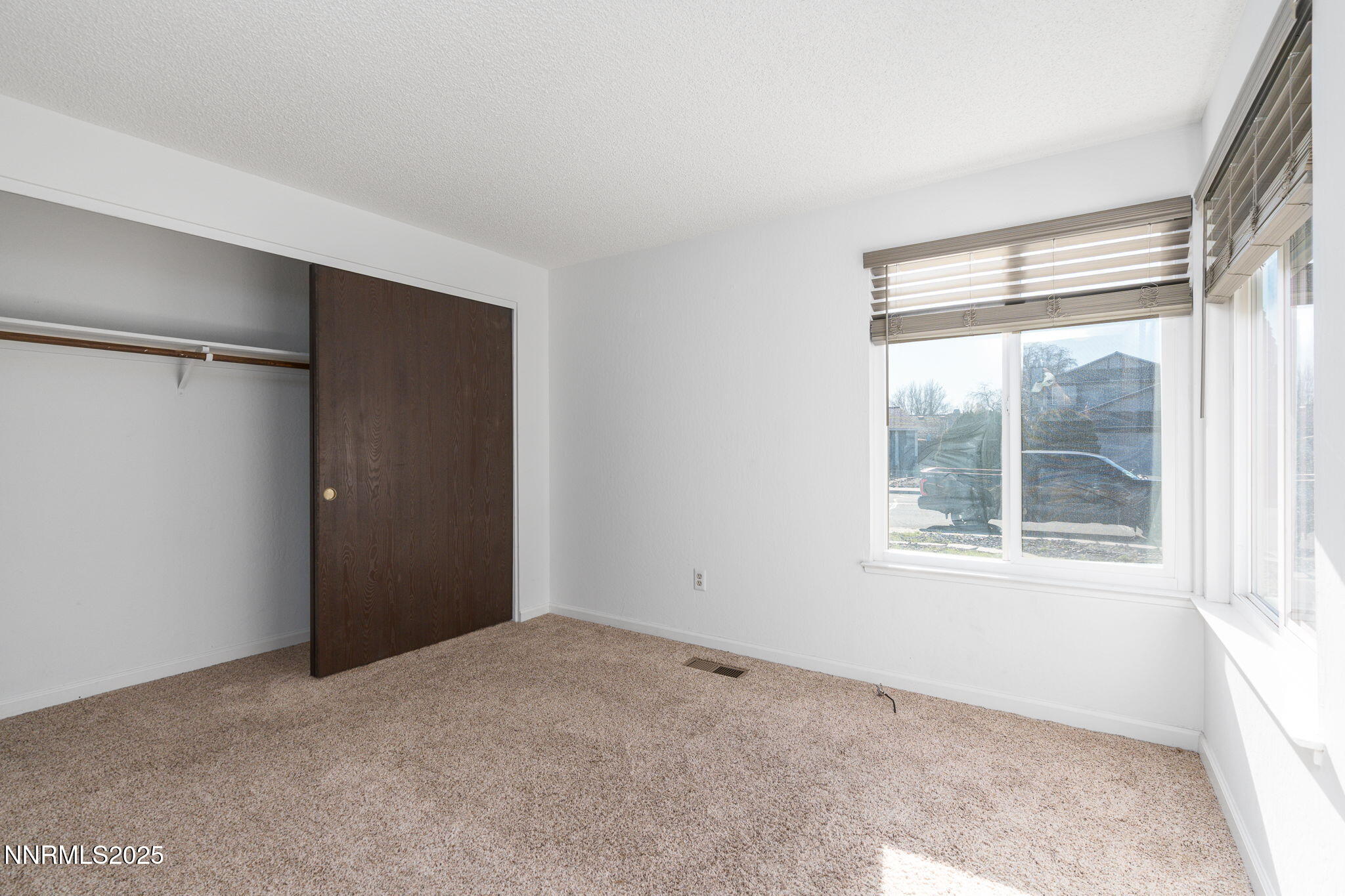1266 Junction Drive Sparks, NV 89434 - Photo 23 of 32 a view of an empty room with a window