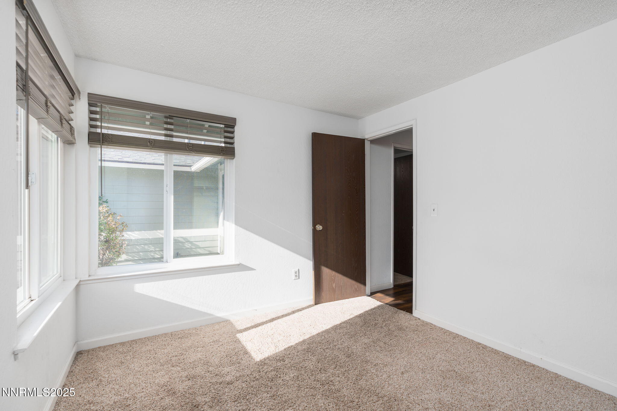 1266 Junction Drive Sparks, NV 89434 - Photo 24 of 32 a view of an empty room with a window