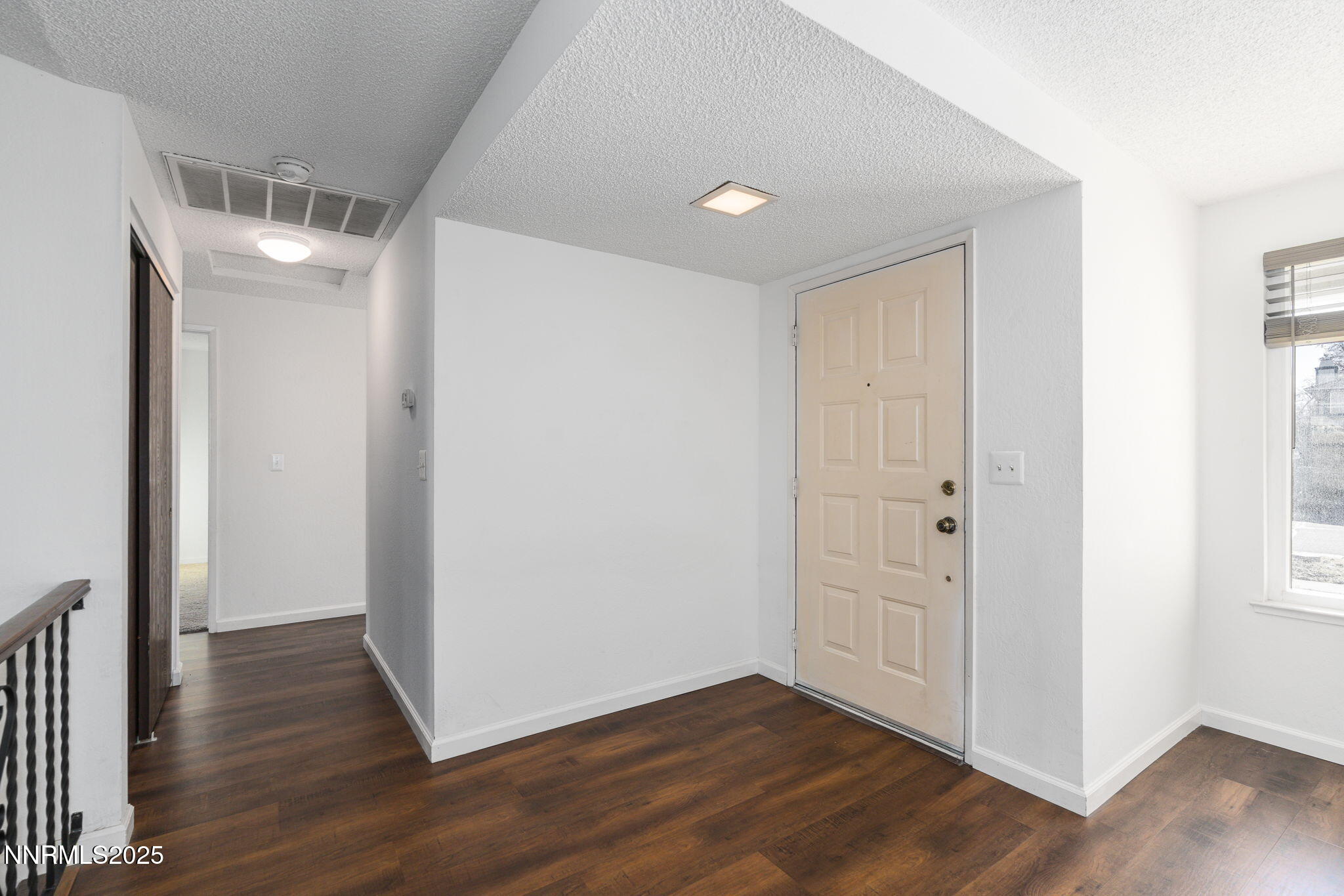 1266 Junction Drive Sparks, NV 89434 - Photo 8 of 32 a view of an empty room with wooden floor
