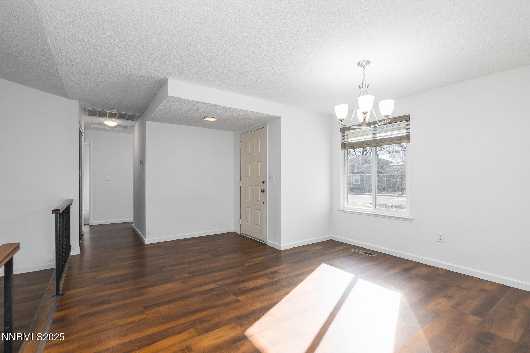 1266 Junction Drive Sparks, NV 89434 - Photo 10 of 32 a view of empty room with wooden floor and fan