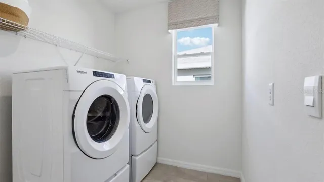 a utility room with dryer and washer
